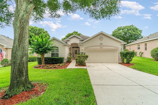 ranch-style house with a garage and a front yard