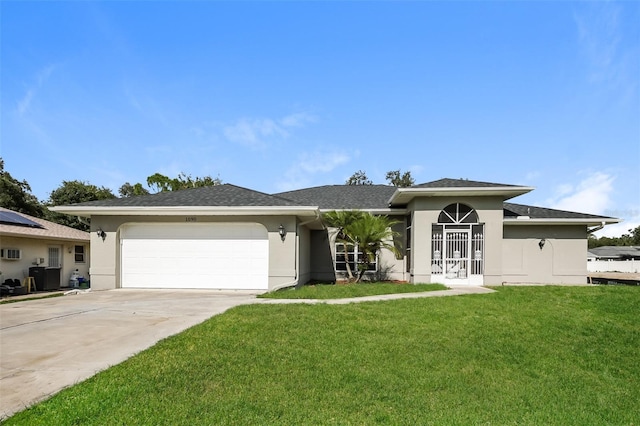 view of front facade with a garage and a front lawn