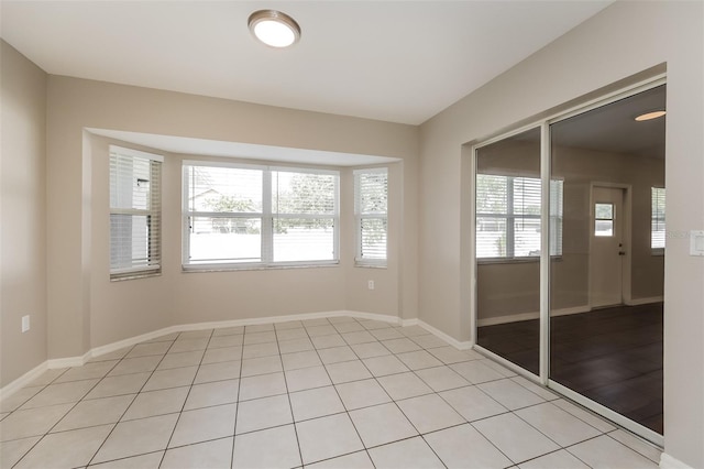 spare room with light tile patterned floors