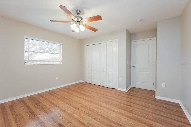 unfurnished bedroom featuring light hardwood / wood-style flooring, a closet, and ceiling fan