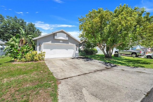 view of front of property featuring a garage and a front lawn