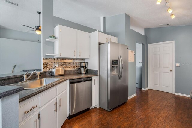 kitchen with dark hardwood / wood-style floors, appliances with stainless steel finishes, rail lighting, and ceiling fan