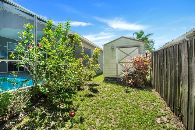 view of yard with a storage unit