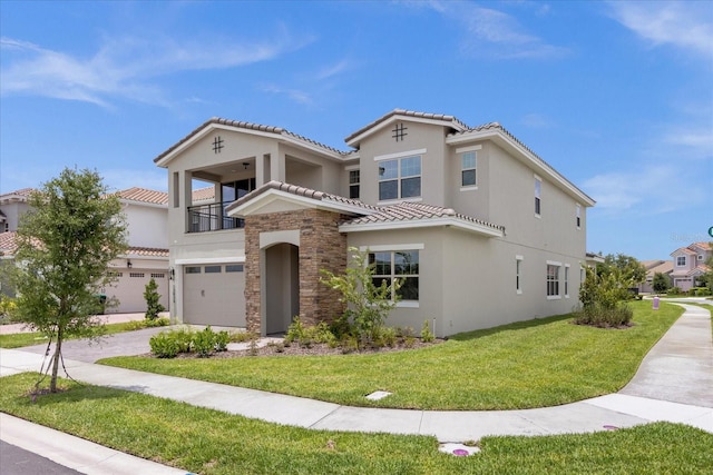 mediterranean / spanish-style house with a front yard, a balcony, and a garage