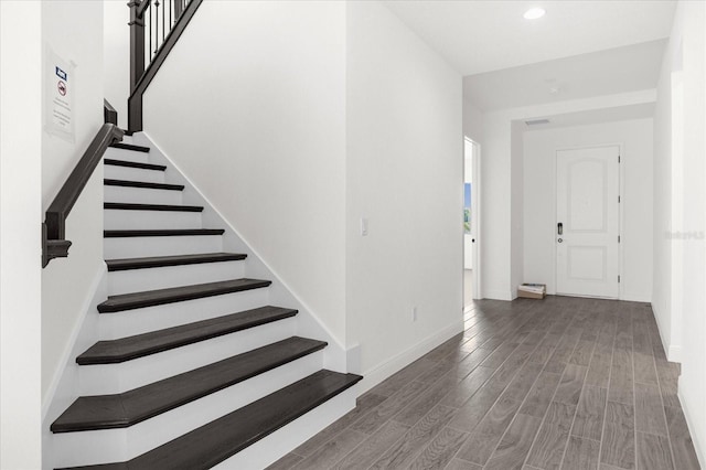 foyer entrance featuring dark hardwood / wood-style floors