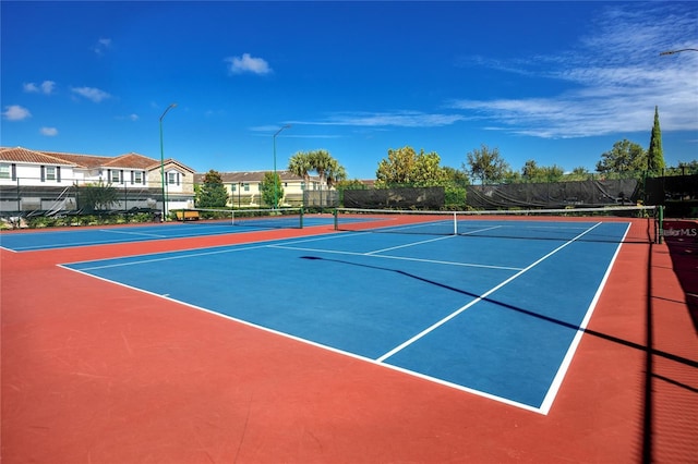 view of tennis court with basketball court