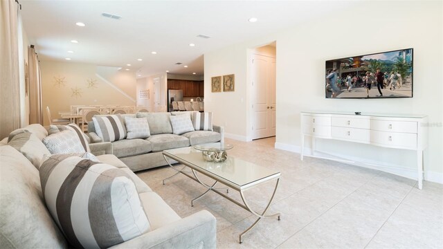 living room with light tile patterned floors