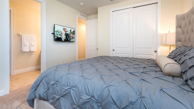 carpeted bedroom featuring a closet