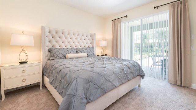 carpeted bedroom featuring access to exterior