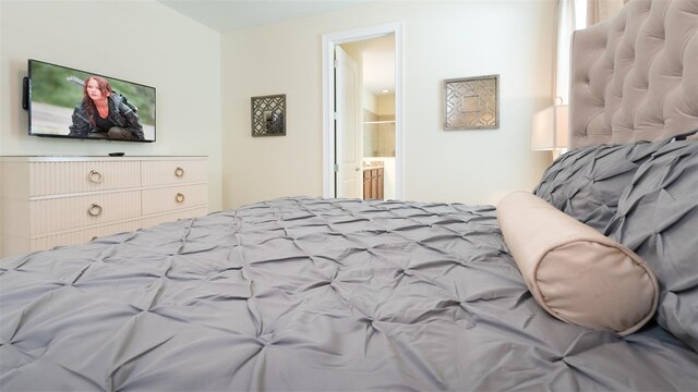 bedroom featuring ensuite bath