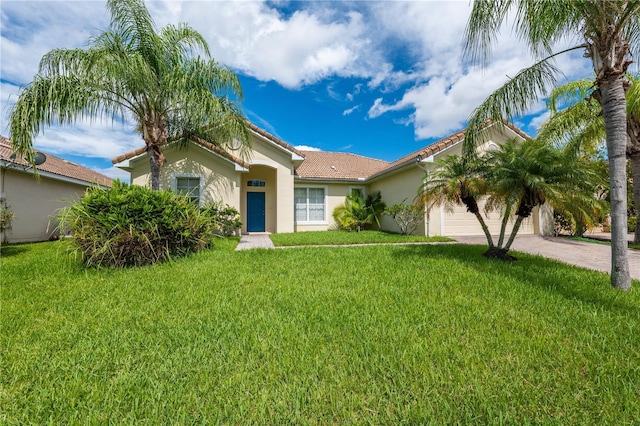 view of front facade featuring a garage and a front lawn