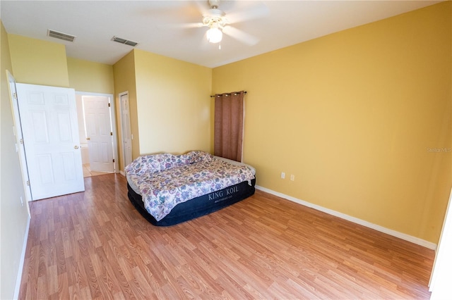 bedroom featuring ceiling fan and hardwood / wood-style floors