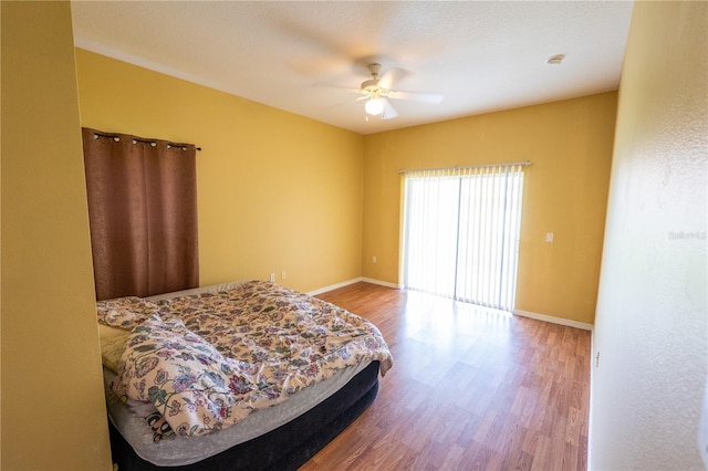 bedroom featuring ceiling fan and hardwood / wood-style flooring