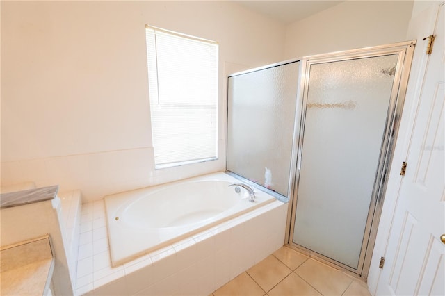 bathroom with tile patterned flooring and plus walk in shower