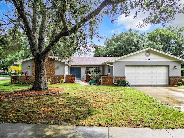 ranch-style home featuring a front yard and a garage