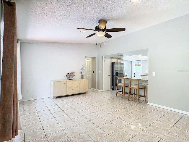 interior space featuring ceiling fan and a textured ceiling