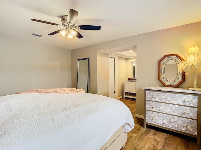 bedroom with ceiling fan and wood-type flooring