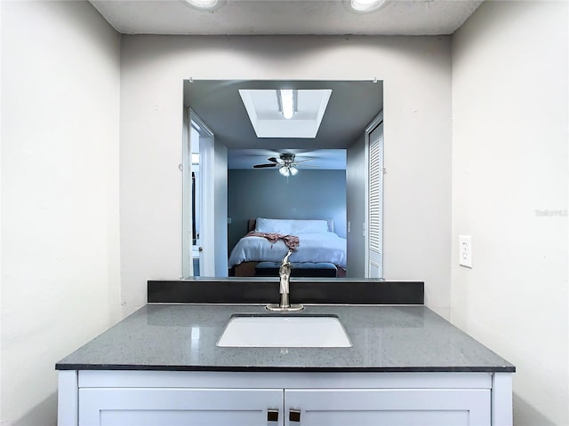 room details featuring a skylight, ceiling fan, and sink