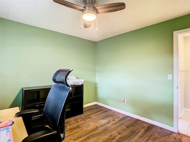 office space with hardwood / wood-style flooring and ceiling fan