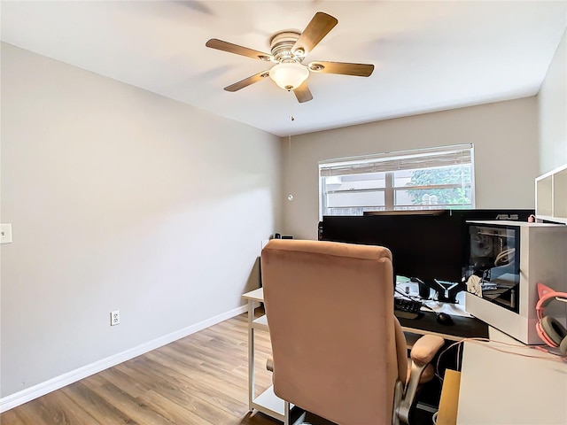 home office featuring ceiling fan and light hardwood / wood-style floors