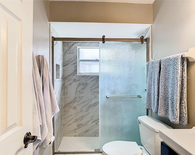 bathroom with vanity, toilet, and an enclosed shower