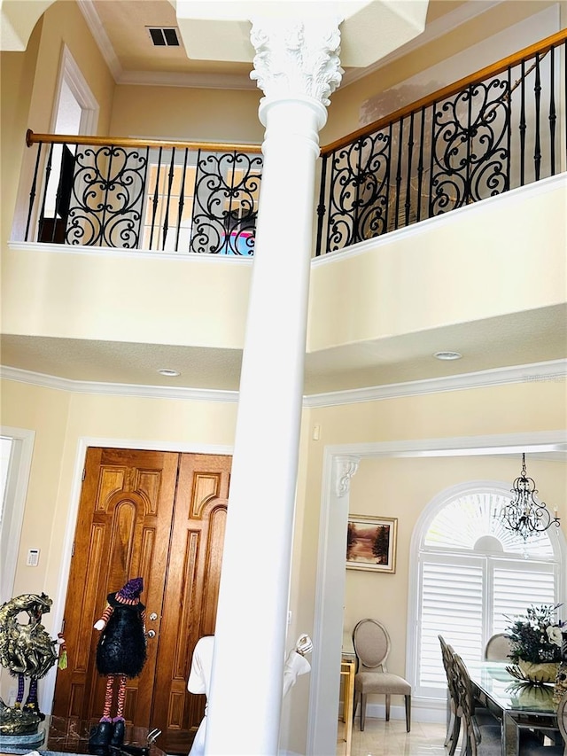 room details with visible vents, an inviting chandelier, and ornamental molding