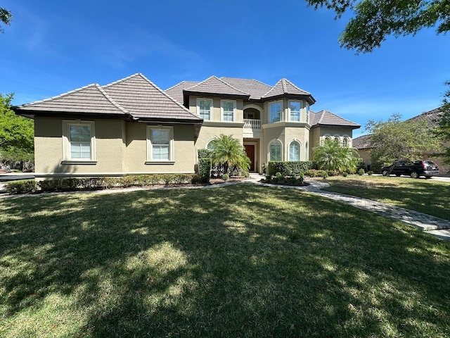 8734 Crestgate Cir, Orlando, FL 32819 - view of front facade with stucco siding and a front yard