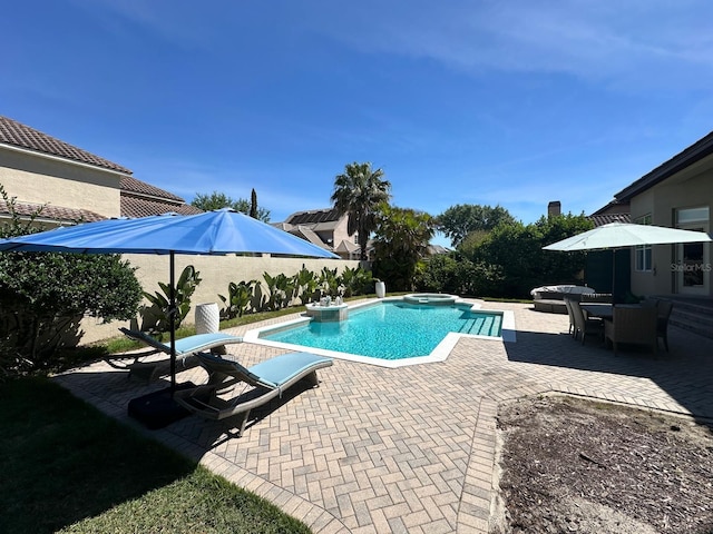 8734 Crestgate Cir, Orlando, FL 32819 - view of swimming pool with a patio area, a pool with connected hot tub, and a fenced backyard