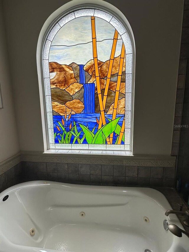 8734 Crestgate Cir, Orlando, FL 32819 - full bathroom with a whirlpool tub