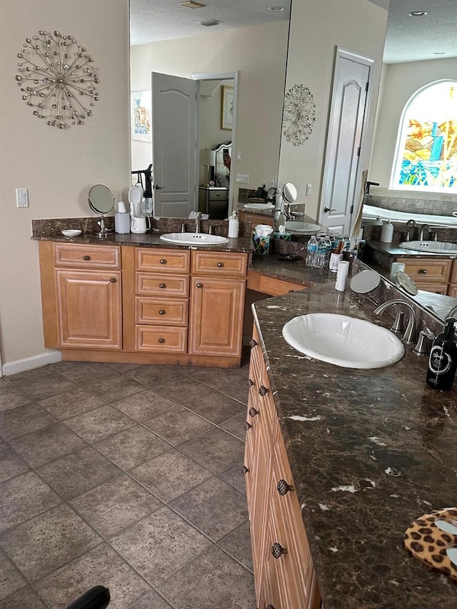 8734 Crestgate Cir, Orlando, FL 32819 - bathroom with vanity and a textured ceiling