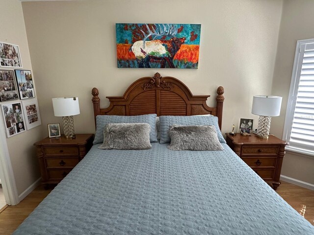 8734 Crestgate Cir, Orlando, FL 32819 - bedroom featuring wood finished floors and baseboards