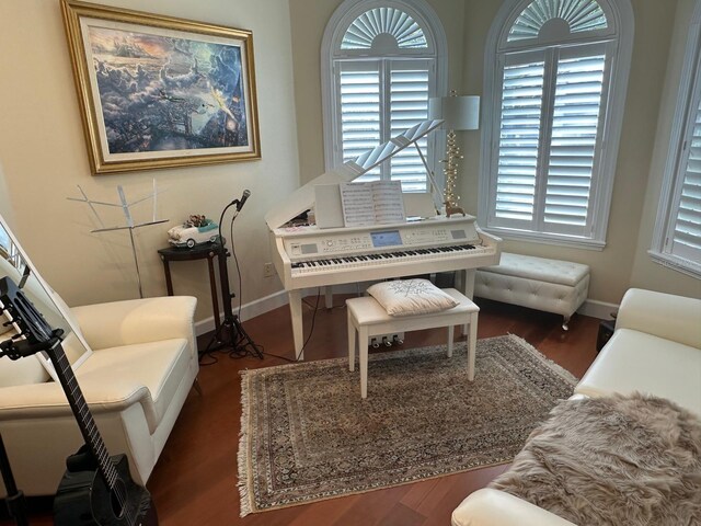 8734 Crestgate Cir, Orlando, FL 32819 - sitting room with wood finished floors and baseboards