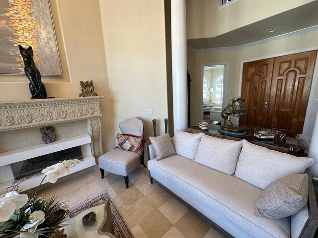 8734 Crestgate Cir, Orlando, FL 32819 - living room featuring decorative columns and crown molding
