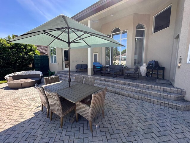 8734 Crestgate Cir, Orlando, FL 32819 - view of patio / terrace featuring an outdoor living space