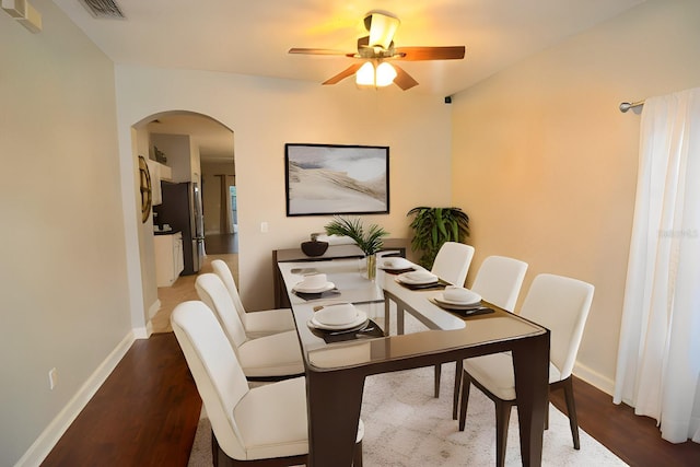 dining room featuring ceiling fan and dark hardwood / wood-style flooring