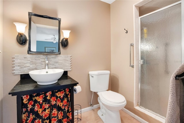 bathroom with tile patterned floors, an enclosed shower, toilet, decorative backsplash, and vanity