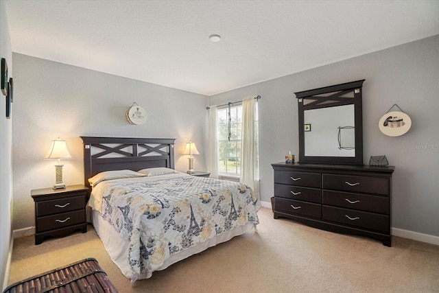 bedroom featuring light carpet