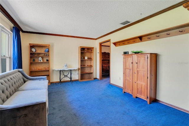 living area with dark colored carpet, a textured ceiling, and ornamental molding