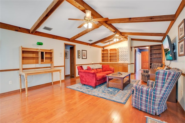 living room featuring vaulted ceiling with beams, ceiling fan, built in features, and hardwood / wood-style flooring