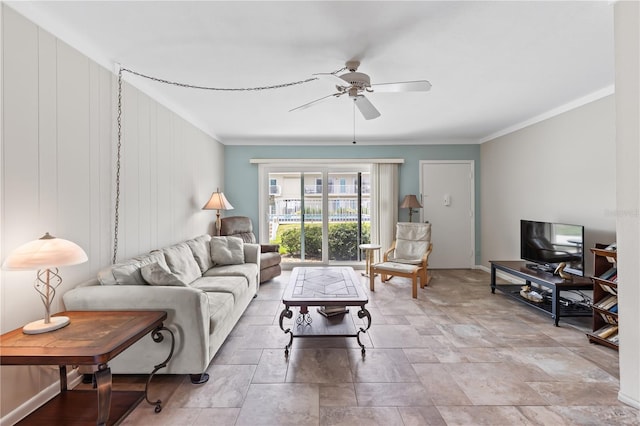 living room with ceiling fan and crown molding