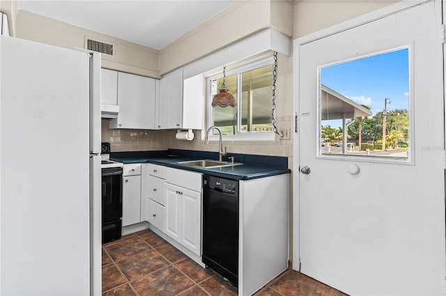 kitchen featuring electric stove, dishwasher, white fridge, sink, and white cabinets