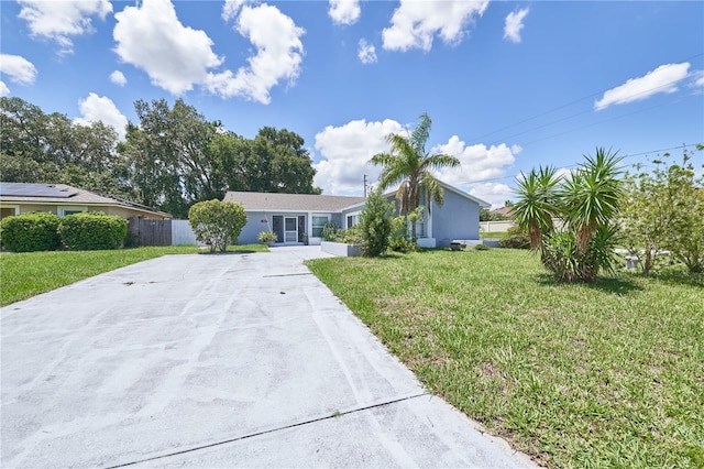 ranch-style house with a front lawn