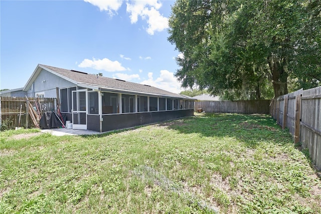 view of yard featuring a sunroom