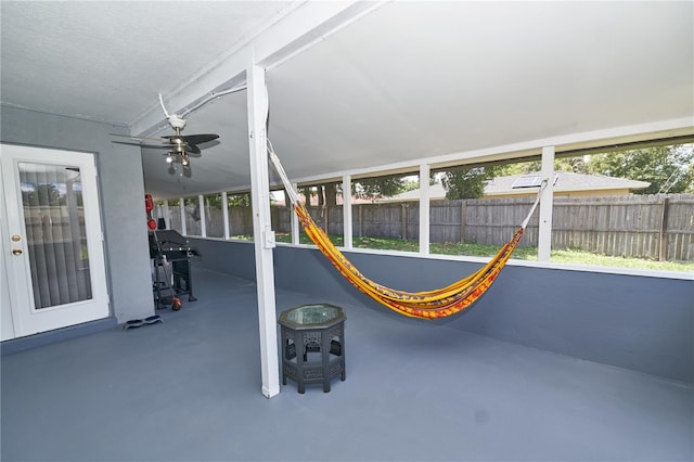 exterior space with a grill and ceiling fan