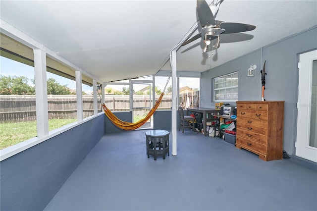 sunroom / solarium featuring ceiling fan