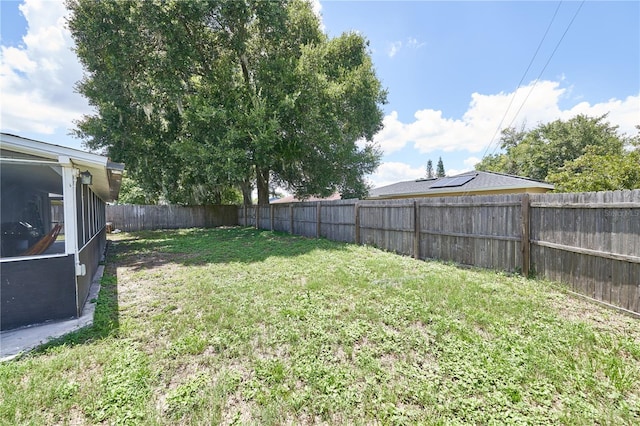 view of yard with a sunroom