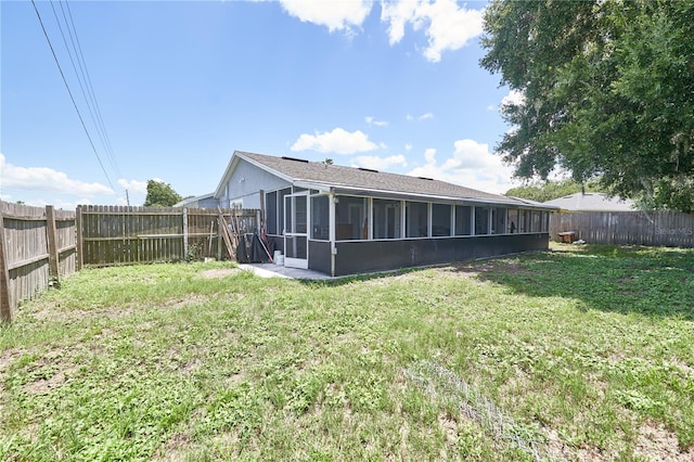 view of yard with a sunroom