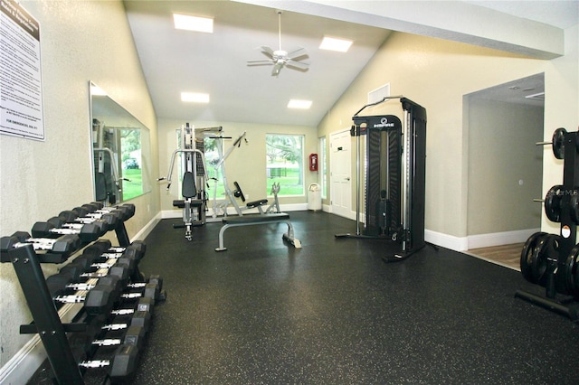 workout area with baseboards, lofted ceiling, and a ceiling fan