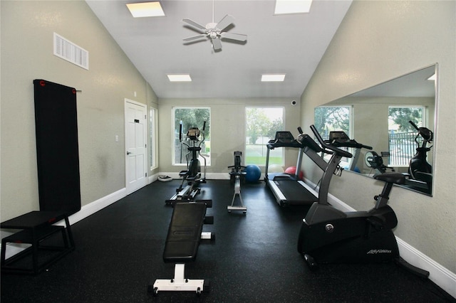 exercise room featuring visible vents, baseboards, high vaulted ceiling, and ceiling fan