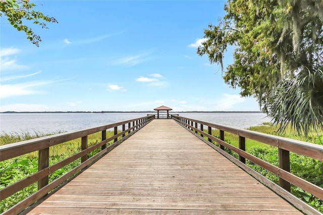 dock area with a water view and a gazebo